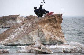 kiteboarding off a massive iceberg kicker in Lake Michigan