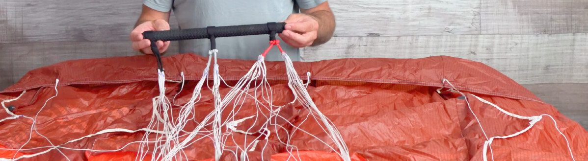 The bar is simple but has some nice features. Tucker holding the control bar for the Aeryn P1 parawing