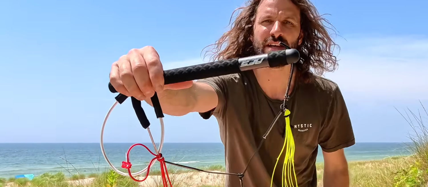 The Stow features a carbon handle. Tucker holds up the Stow's bar.