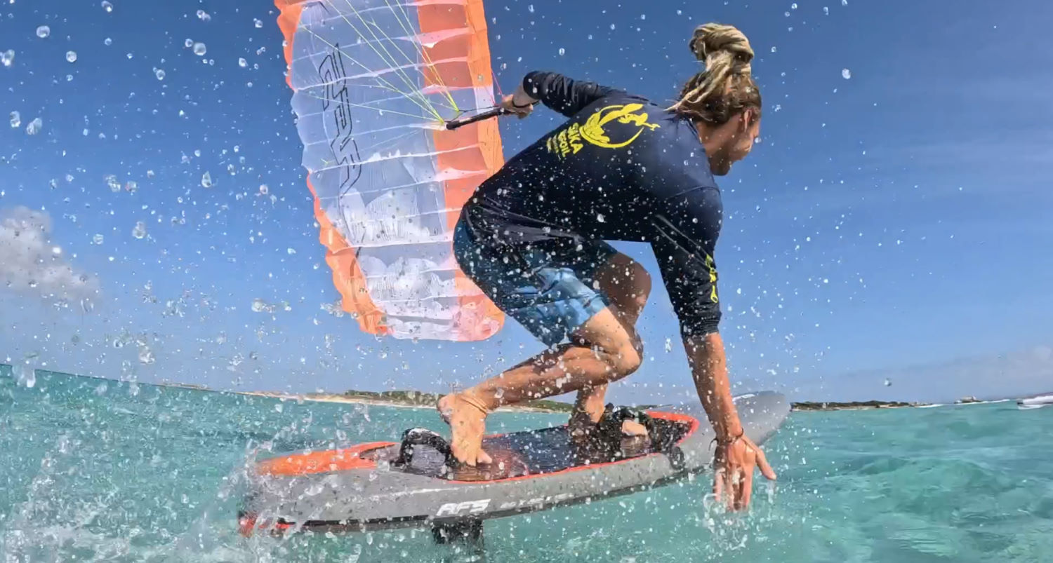 The Stow can be a very fun parawing. A rider crouches low while dragging his hand in the water.