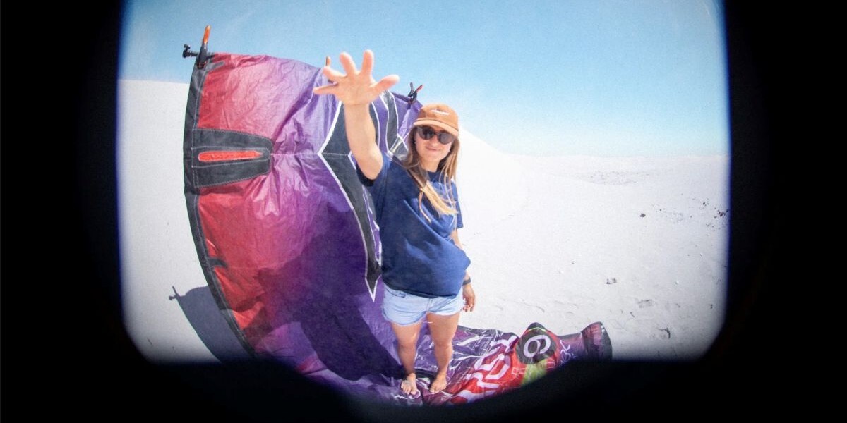 Alessa Mensch spotlight standing on a kite