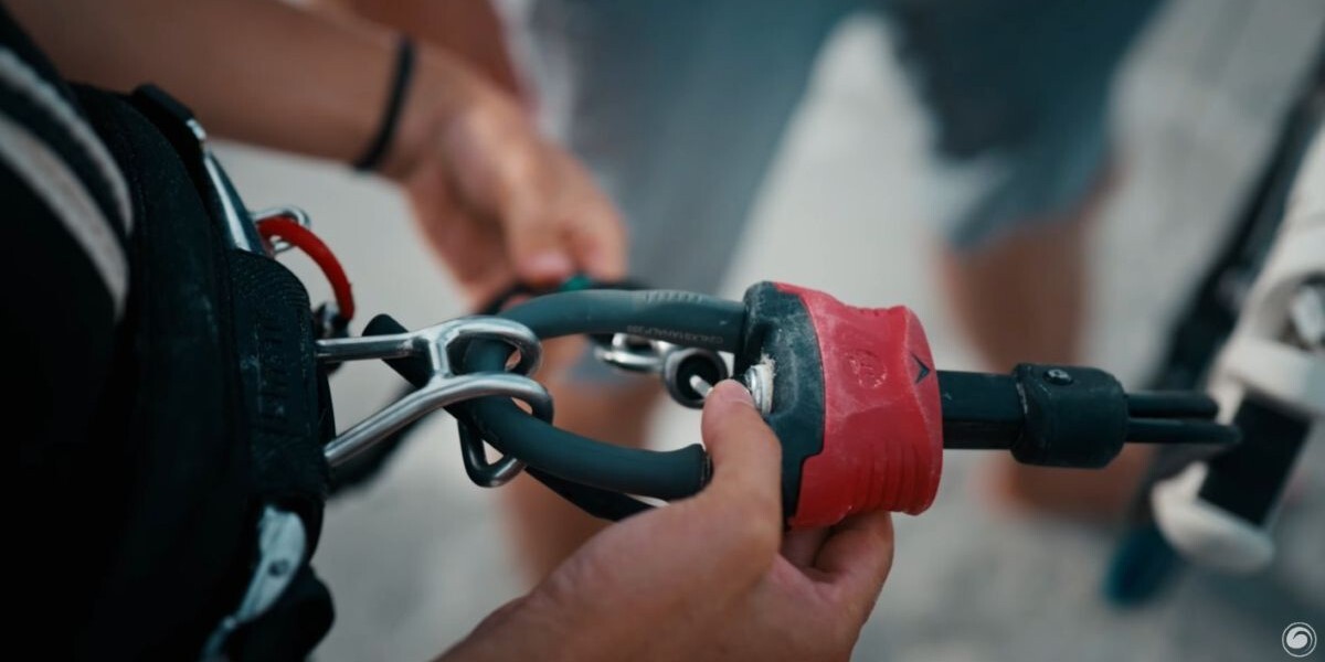 Look at the rigging for connecting your harness to your control bar, including the chicken loop, chicken finger, and safety leash