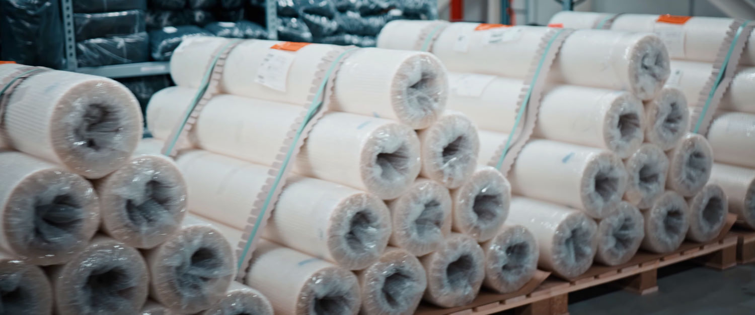 You can have it in any color you want, as long as you want white. Stacks of only white fabric at the Brainchild factory.