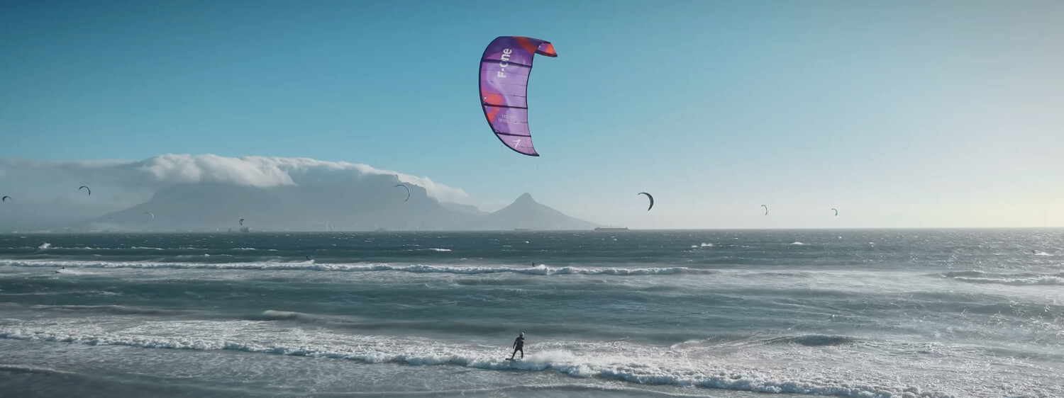 The future looks bright for Brainchild kites. An F-One Trigger Brainchild kite flies in the sky.