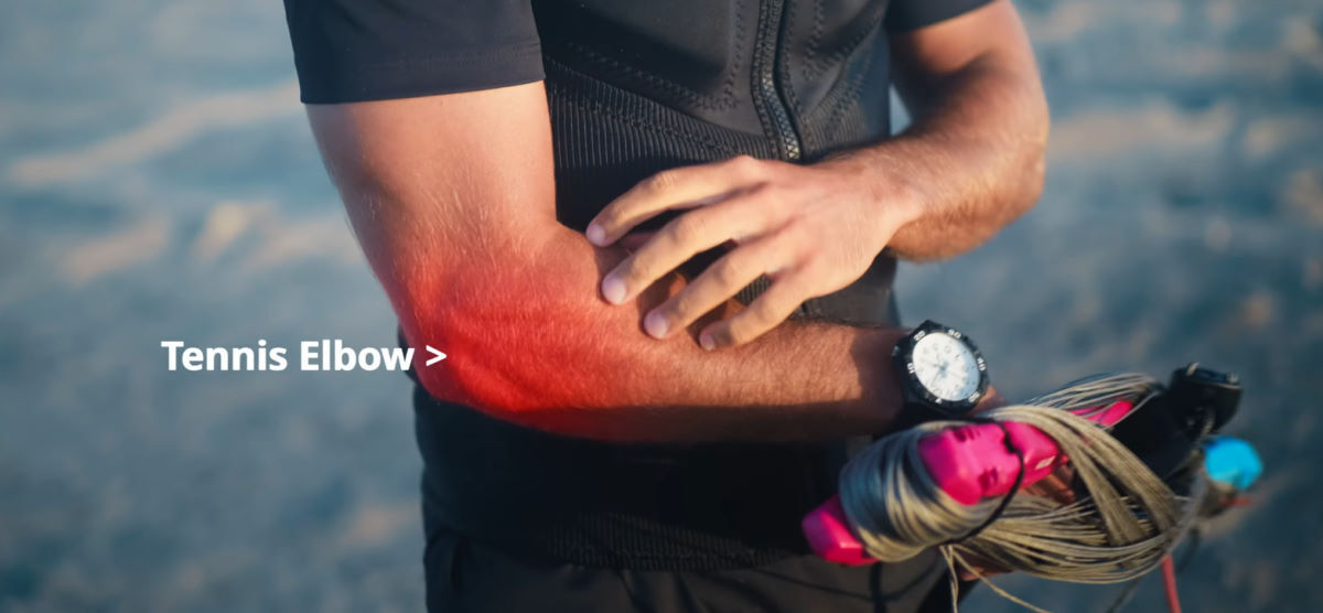 If you've felt this pain, you know what a session-killer it can be. A kiteboarder rubs his sore, red elbow.
