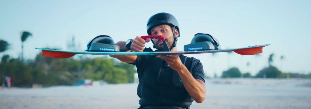 Rubens holds the board up to show its edge profile.