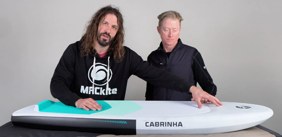 Tucker and Jeff look at the deck of the Code foilboard.