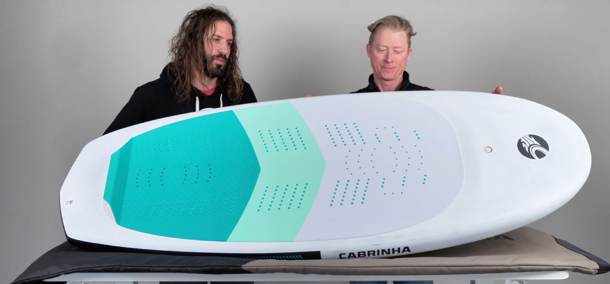 Tucker and Jeff look at the top of the Code foilboard.