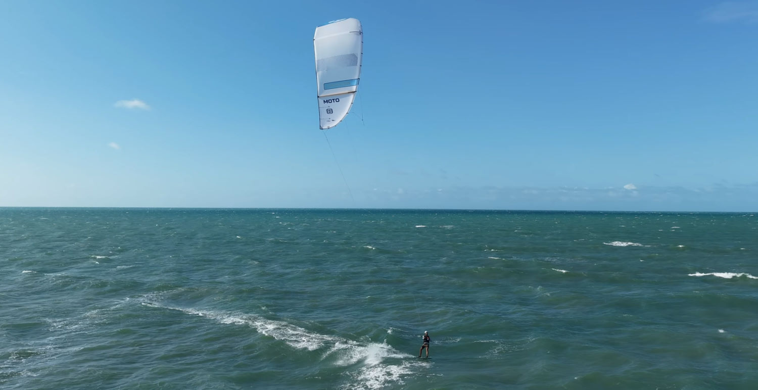 Is the 2026 Cabrinha Moto Apex right for you? A kiteboarder cruises across the water with the Cabrinha Moto Apex.