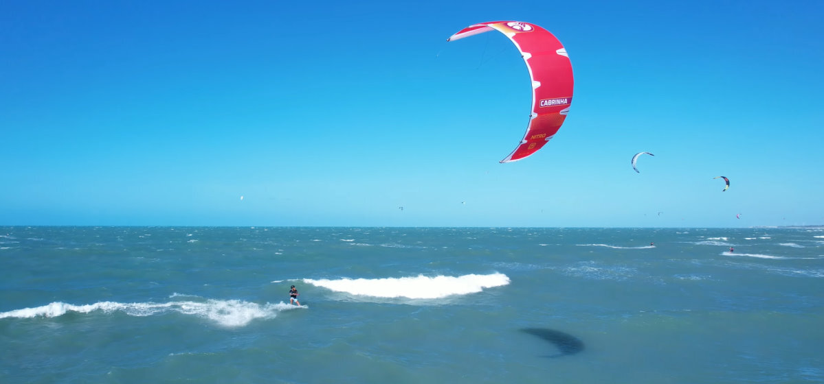 A kiteboarder riding behind the Cabrinha Nitro kite.