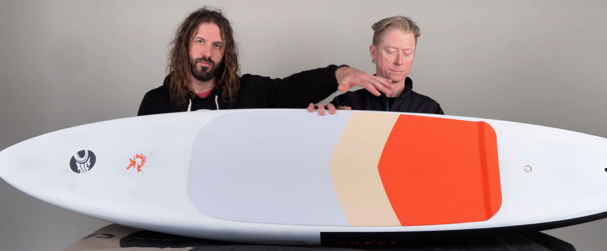 Tucker and Jeff examine the top of the Quest downwind board.