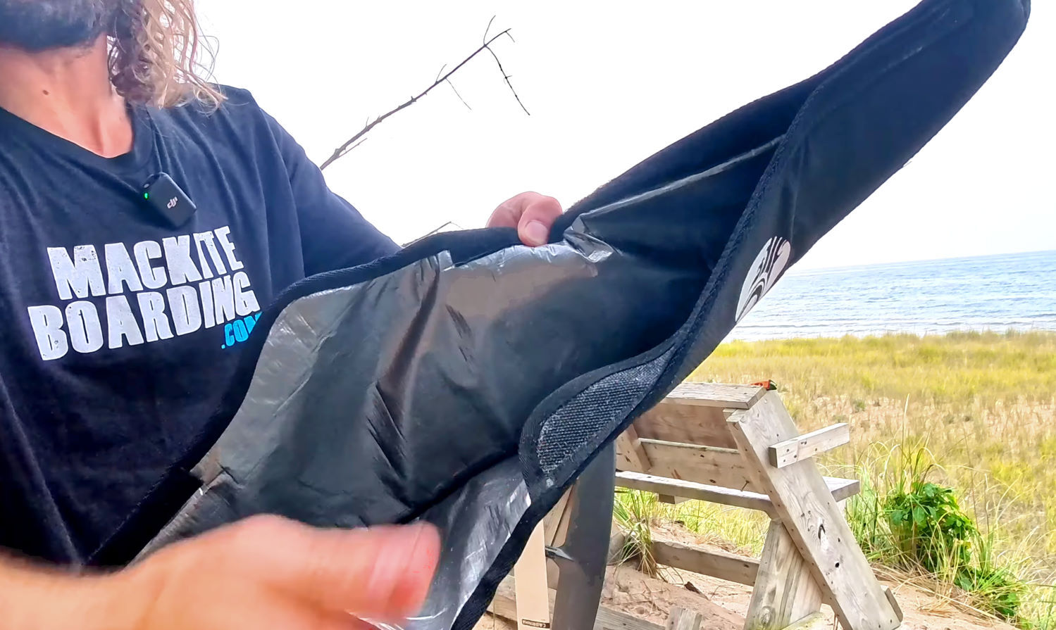 A flap helps protect and secure your foil. Tucker holds open a foil cover, showing the internal flap.
