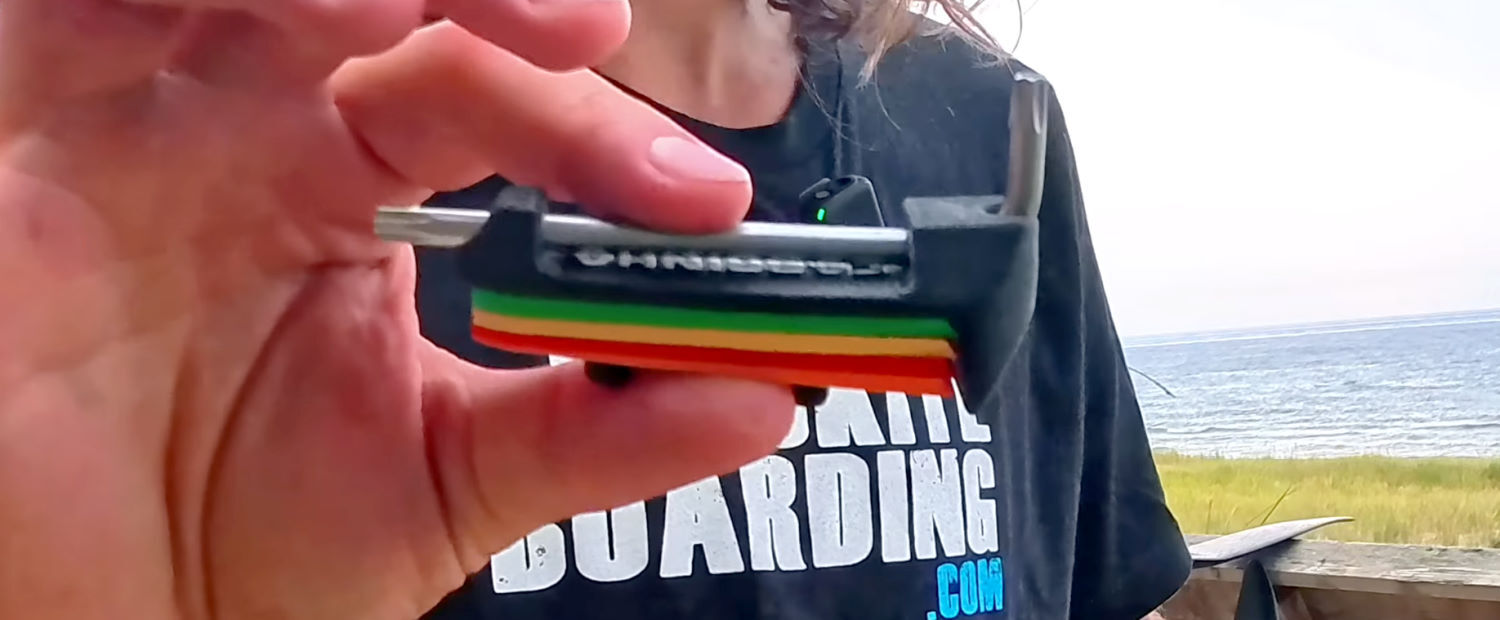 This handy little tool lets you swap shims anytime and anywhere. Tucker holds up the shim carrier and wrench tool.