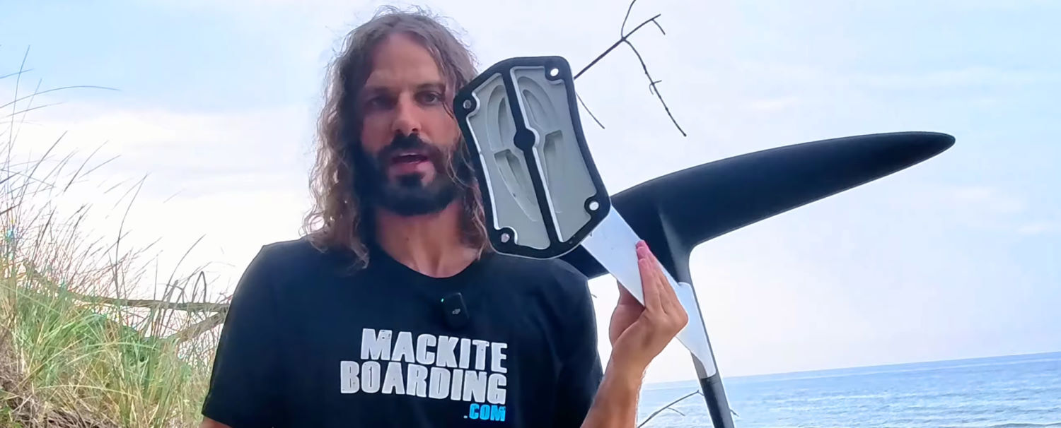 The top plate is lighter and stiffer. Tucker shows off the top plate of the mast.
