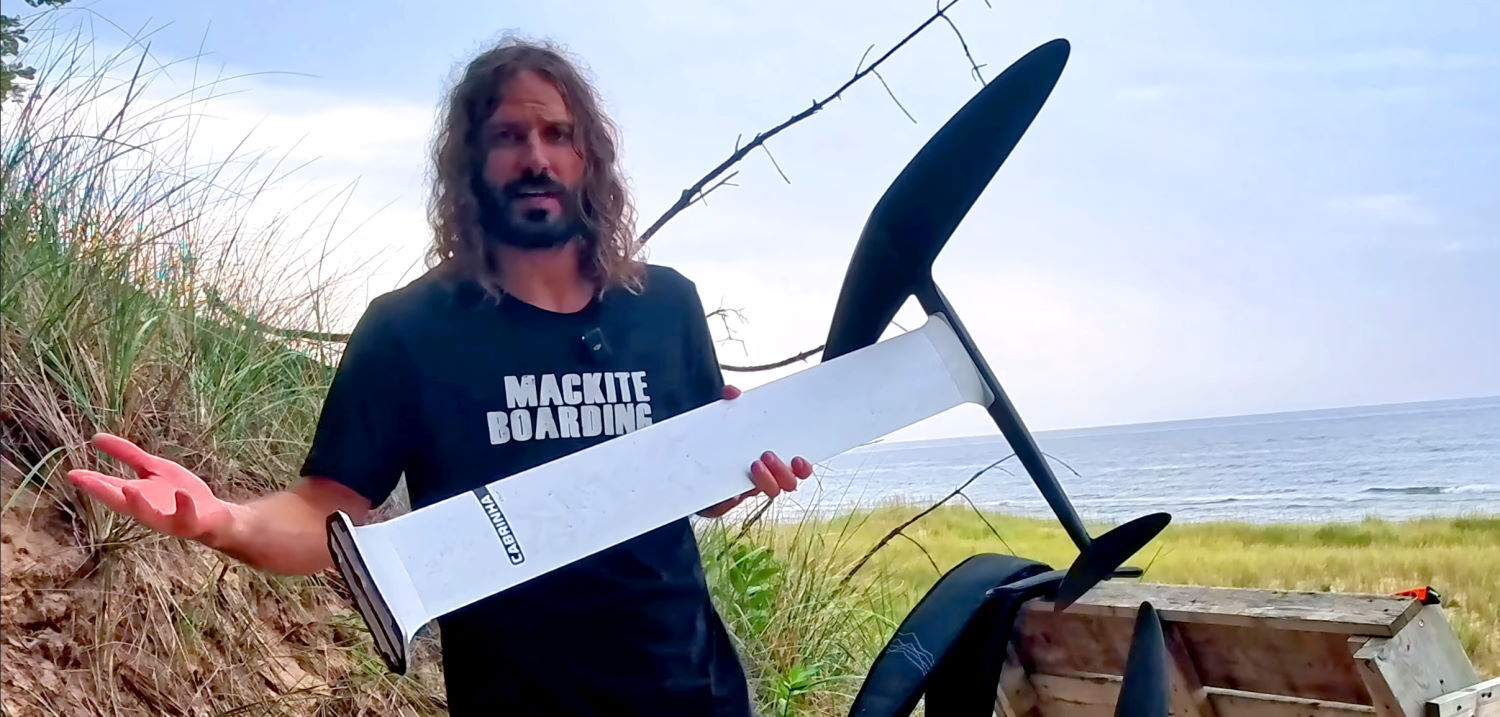 Aluminum is light, stiff and budget-friendly. Tucker holds the aluminum mast in one hand.