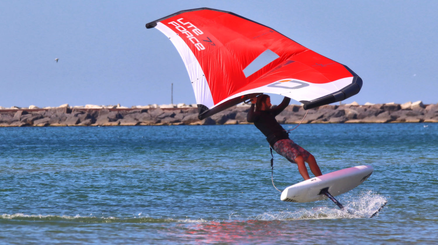Tucker banks hard while wing foiling.