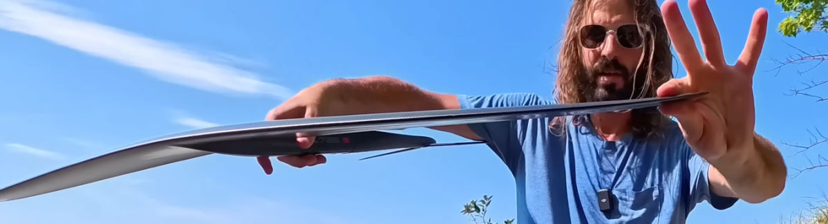 Tucker shows how the wingtips flare upward.