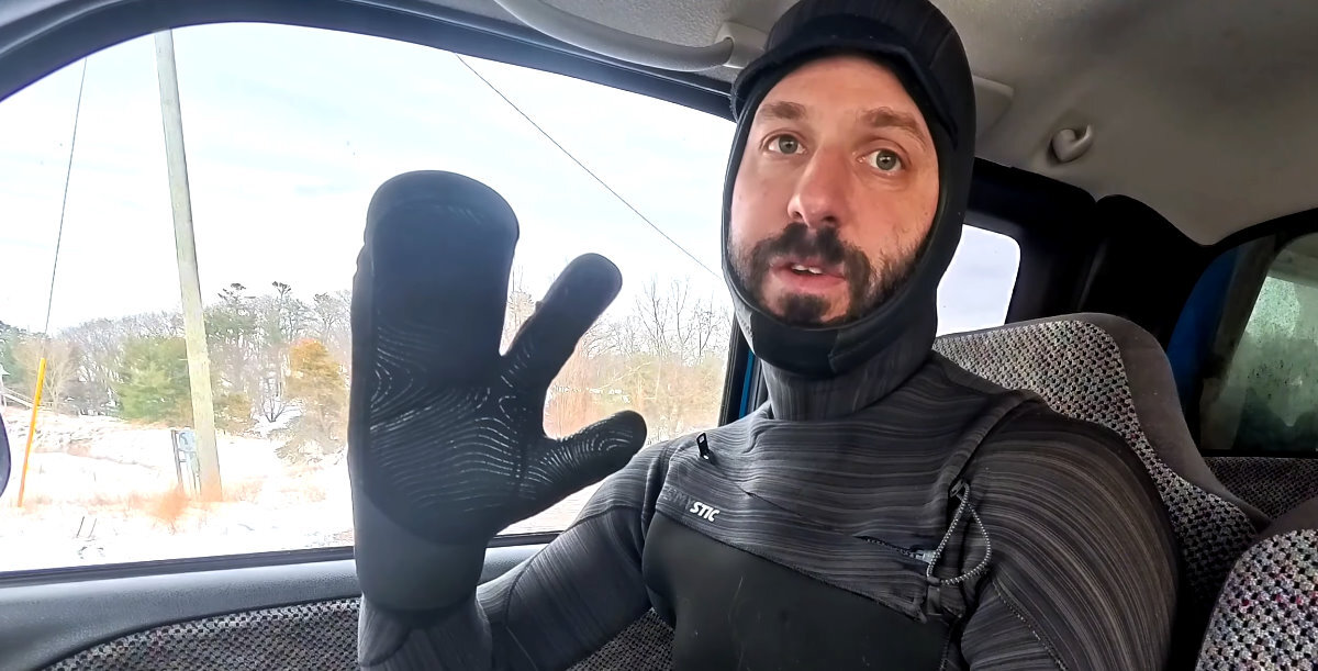 Tucker holds up a gloved hand.