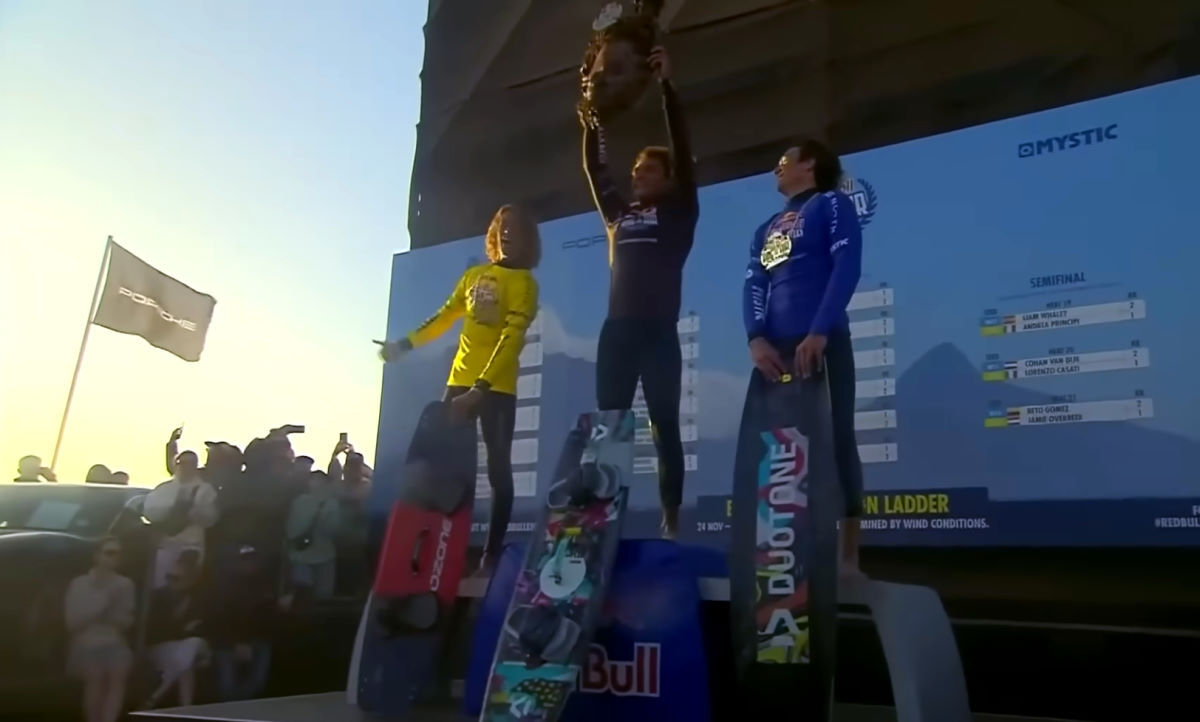 Lorenzo stands on the podium at King of the Air after winning with a Duotone Rebel.
