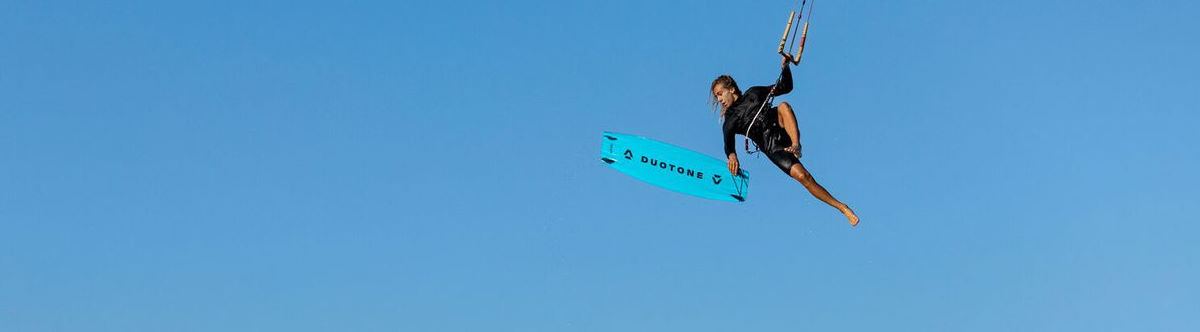 A kiteboarder jumps very high with the TS Big Air SLS kiteboard.