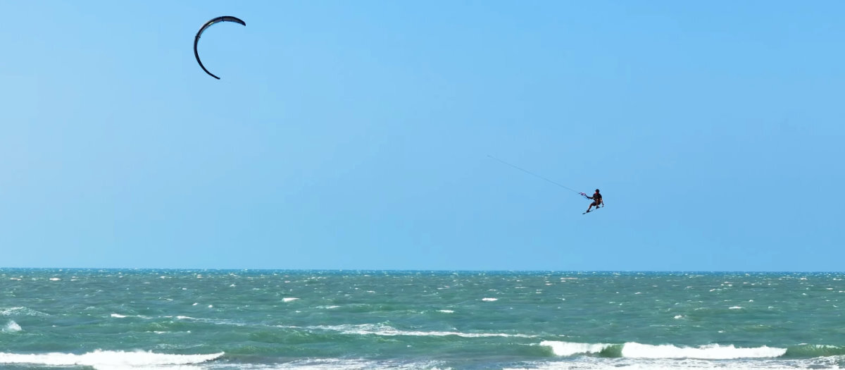 The Evo is easier to jump with its larger sweet spot. A kiteboarder jumps high with the Evo kite.