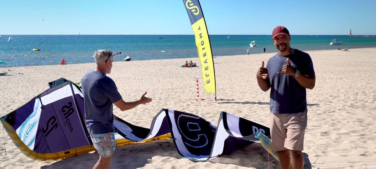 Kevin's got the scoop on the V2 RS Pro for us. Kevin Wade from Eleveight stands on the beach in front of the RS Pro kite.
