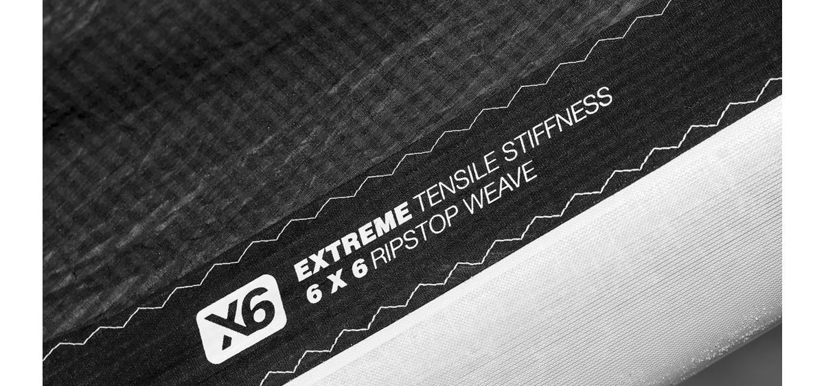 X6 is a strong and light choice of material for the kite's trailing edge. Close-up view of the X6 ripstop material for the trailing edge.