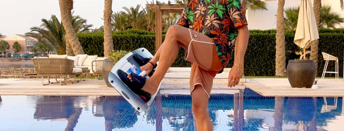 David puts a foot onto the board as he tries to hold onto the taller handle.