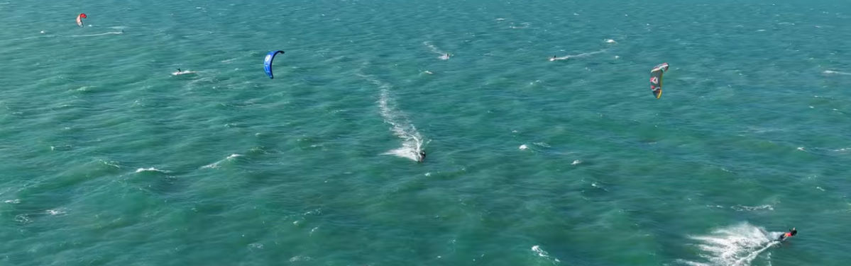 The Reach is a good all-around kite. Gray rides across the water with the North Reach kite.