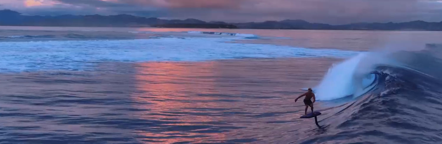 You will catch more waves when you have an eFoil to jet you over to them. A rider surfs a wave using a Fliteboard eFoil.