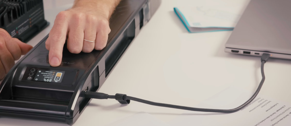 The battery caddy adds features like a power reading and USB charging.