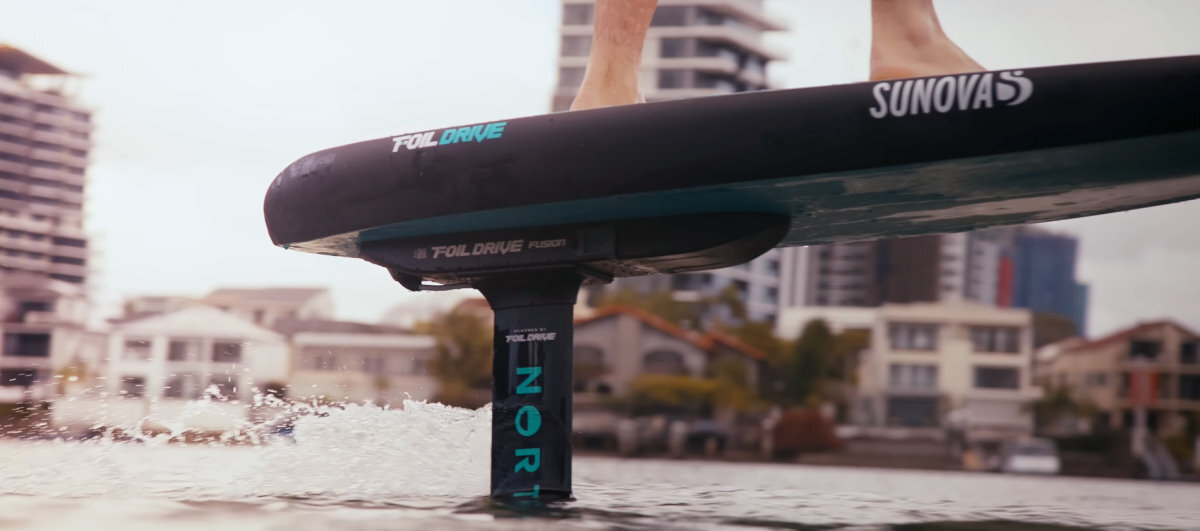 Close-up of the Foil Drive Fusion mounted to the bottom of a foilboard.