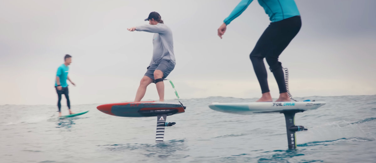 Three riders cruise around on the Foil Drive Fusion.