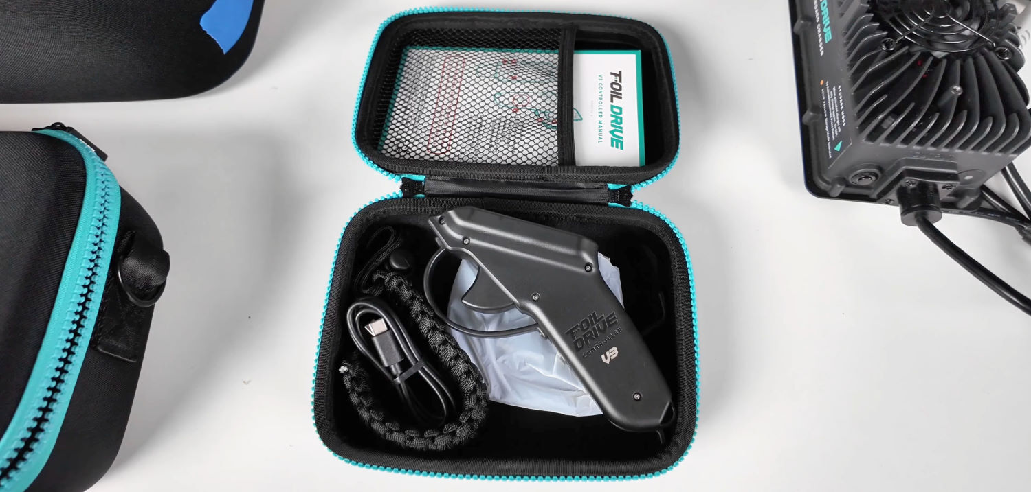 The V3 remote, wrist strap, and charger all come in a nice case. The remote, charging pad, and wrist strap sit in a storage case.