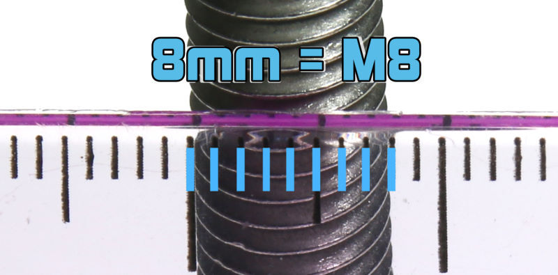 A screw is seen through a ruler, showing it is 8mm wide.