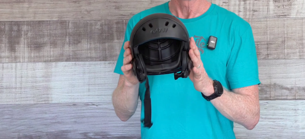 Jeff holds the helmet.