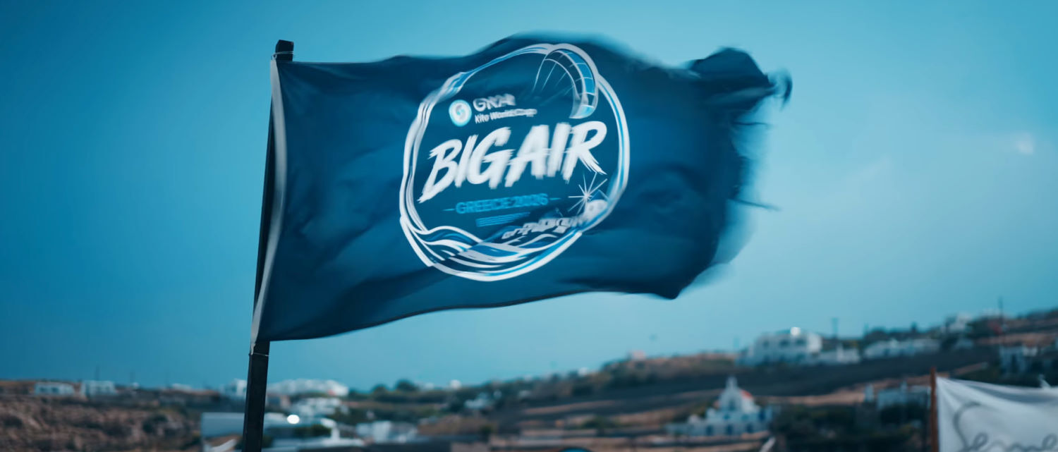 With this much wind, even a flag that's only been up a few days begins to show wear. A GKA flag flaps in the strong wind, its edges beginning to fray.
