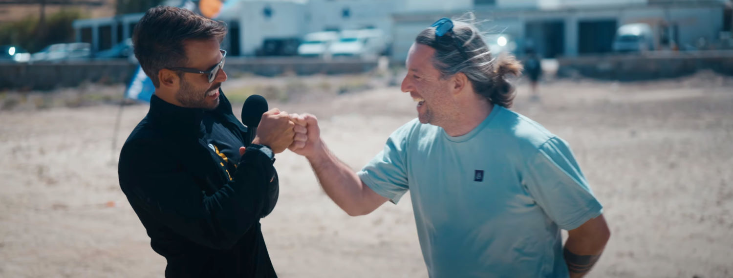 Alex Morgenstern, founder of Harlem Kitesurfing, is stoked about his team's performance. Rubens and Harlem's Alex Morgenstern share a fist bump.