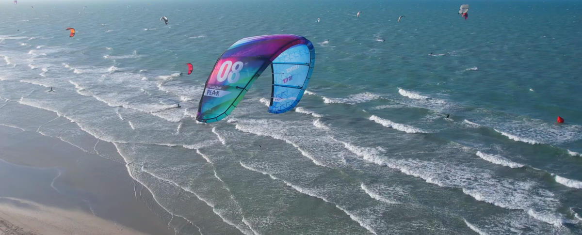 A Harlem Peak kite seen from above as it overs in the air.