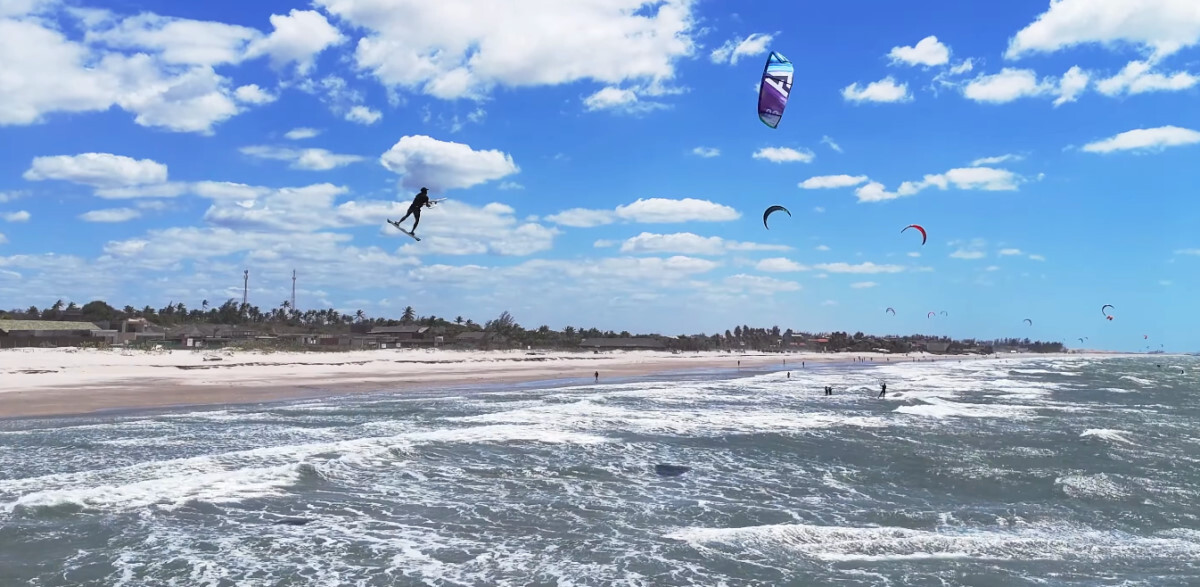 A kiteboarder gets a high jump with the Harlem Thrive kite.