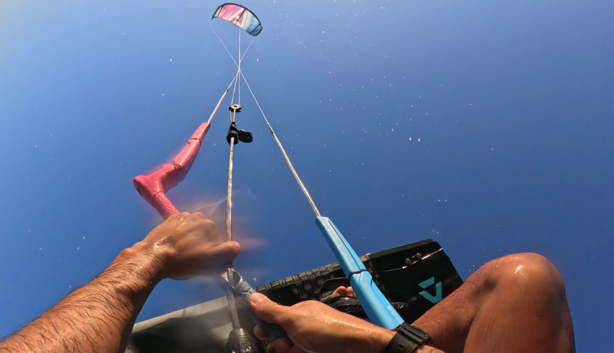 First-person view of a kiteboarder looping his kite while jumping.