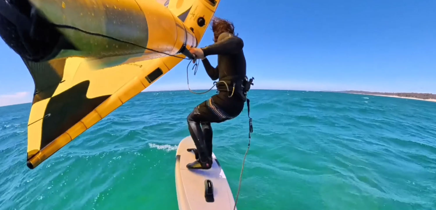 Take a session to practice switching your stance, and it will pay off. Tucker switches his stance while wing foiling.