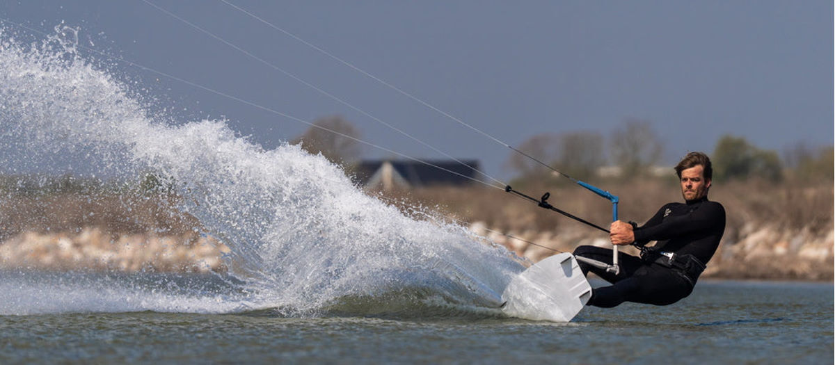 A kiteboarder edges hard with the Jacobsen Yes kite.