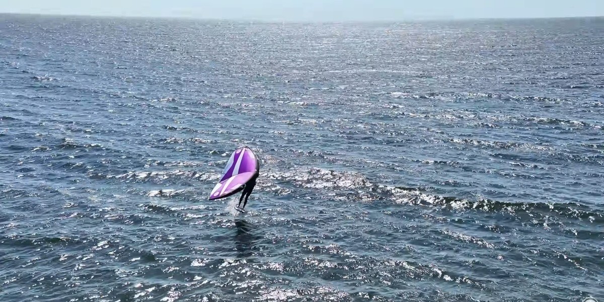 Jeff wing foiling in Lake Michigan