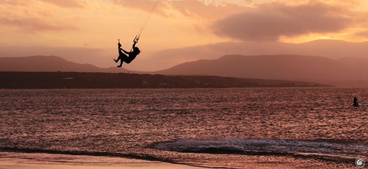 Lana Herman boosting at sunset in Cape Town