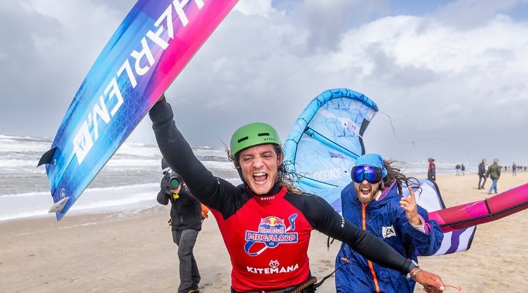 Men cheering while holding Harlem gear at Red Bull's King of the Air competition