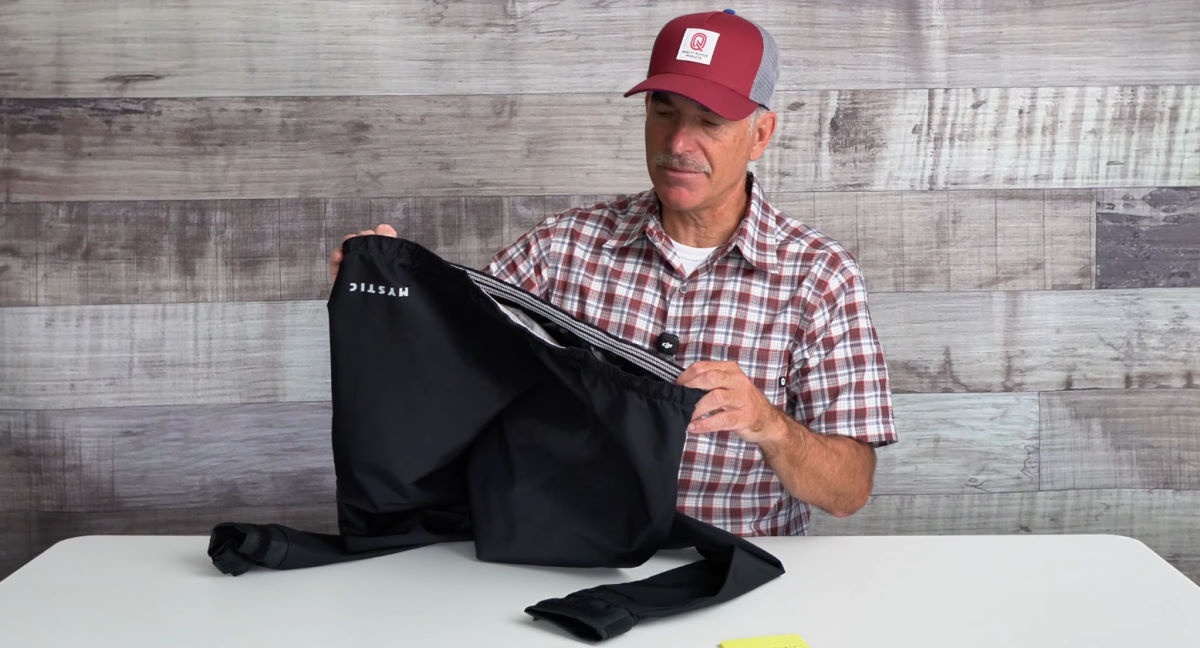 Skip holds the elastic waist of the Gust open.