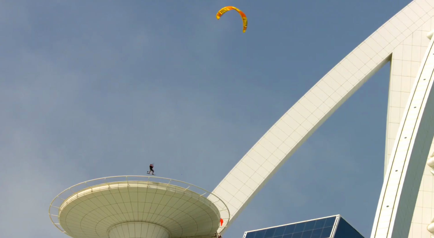 Nick is known for pushing the limits, and his approach to his designs is no different. Nick jumps off a building with his kite.