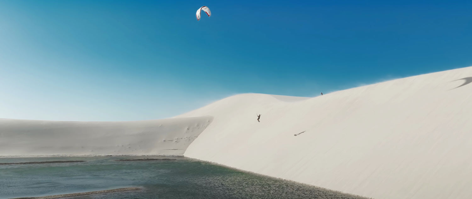 Dropping quickly, Nick pulls a kiteloop to get away from the dune. Nick floats down to the water at the bottom of the dune.
