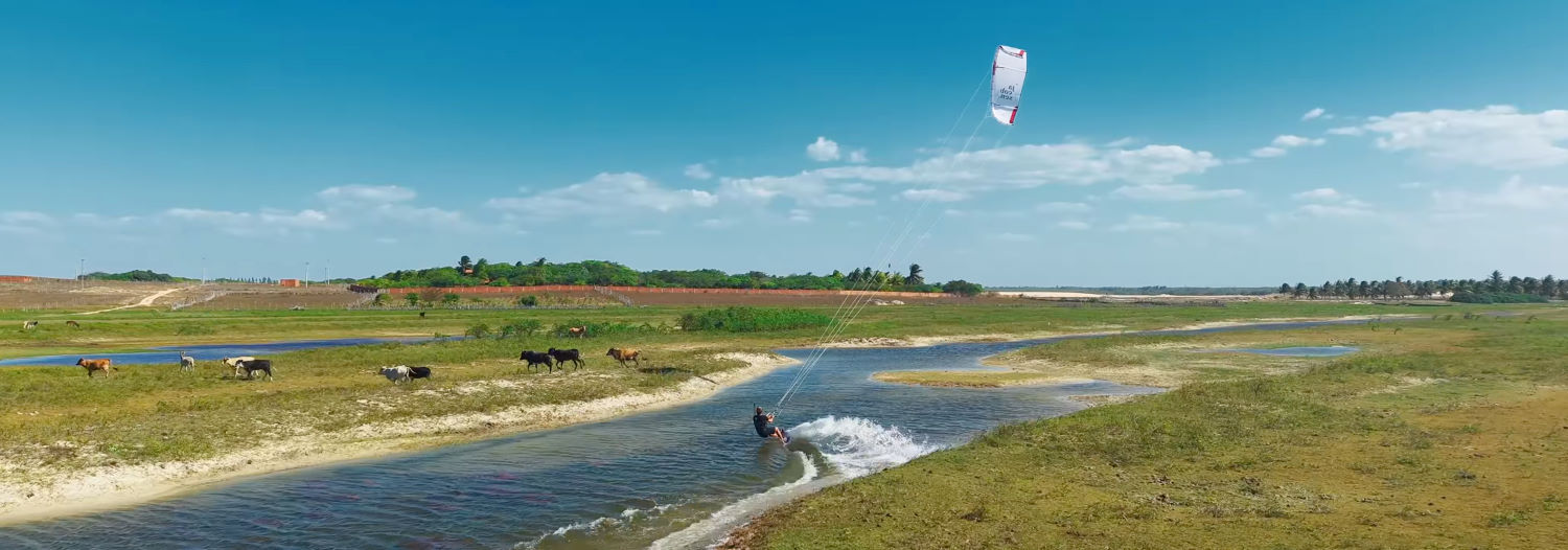 The cows aren't quite sure what to make of a human gliding across the water and stage a strategic retreat. Nick enjoys the scenery while riding the channels.